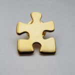Puzzelstukje goud